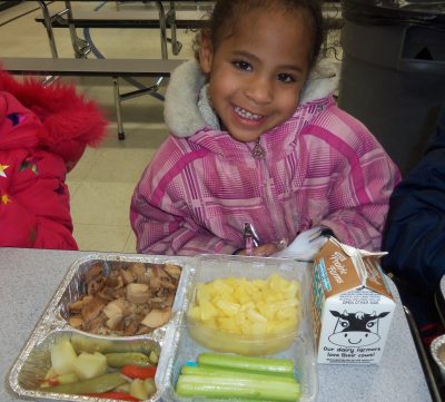 girl eating lunch in cafeteria