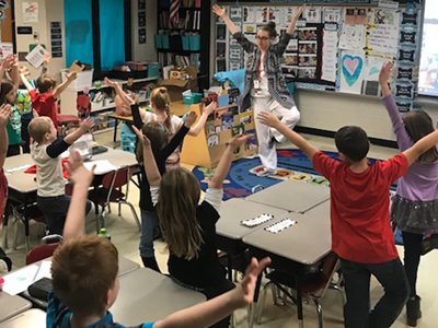 Teacher Leading Class In Yoga Pose