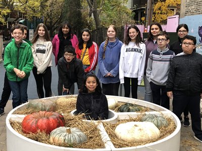 Kids Posing Around Pumpkin Display