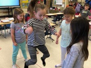 Kids Jumping In Class