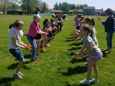 Kids Passing Water Balloons