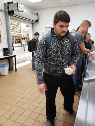 Boy Buying Yogurt