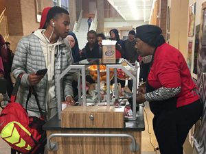 Boy Ordering Meal In Lunch Line