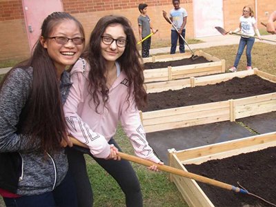 Girls Tending Garden