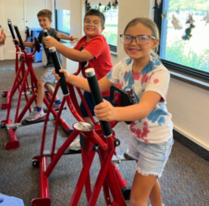 Kirtland students on rowing machines at school